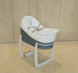 Cozy Grey Wicker Rocking Bassinet with White Stand – Plush Padded, Ideal for Infant Sleep & Nursery Decor